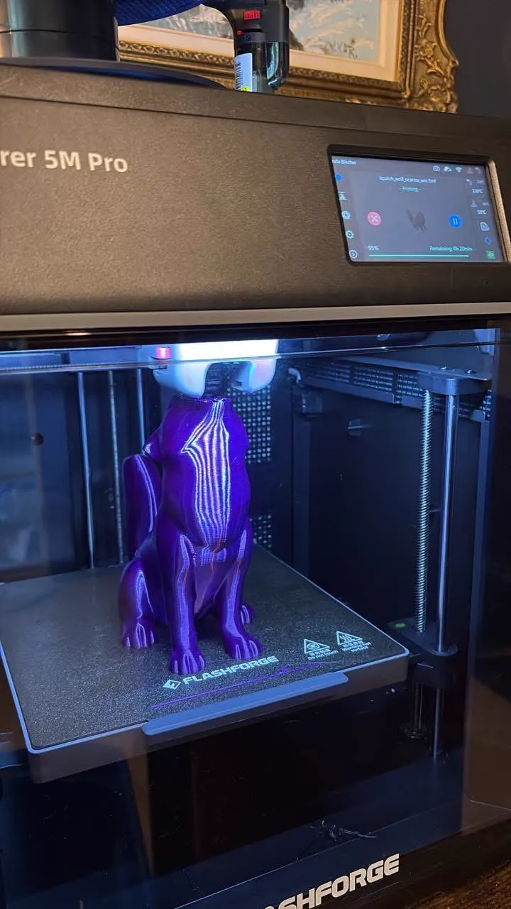 The shop's enclosed printer with a print in progress on the build plate